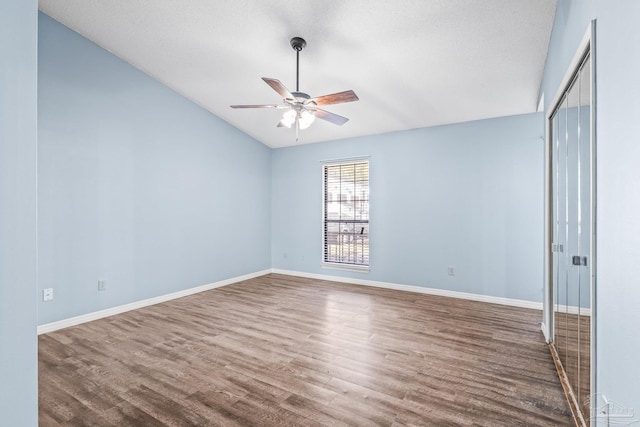 unfurnished bedroom featuring a textured ceiling, dark hardwood / wood-style floors, and ceiling fan