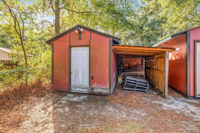 view of outbuilding featuring a carport