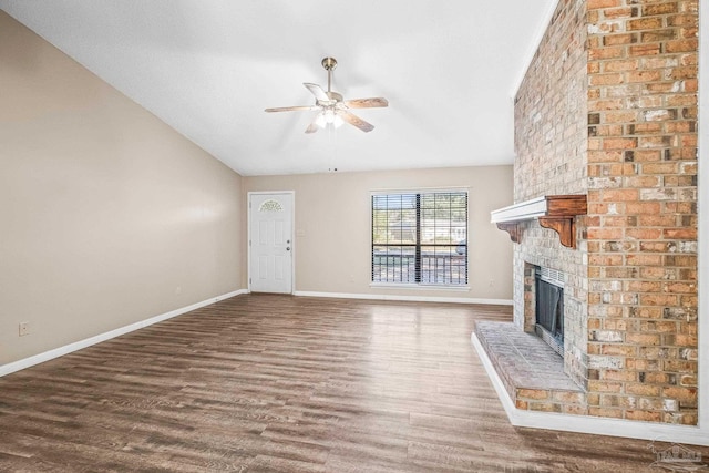 unfurnished living room featuring ceiling fan, wood-type flooring, a fireplace, and vaulted ceiling