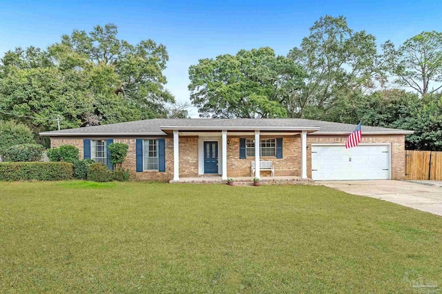 ranch-style house featuring a garage and a front yard