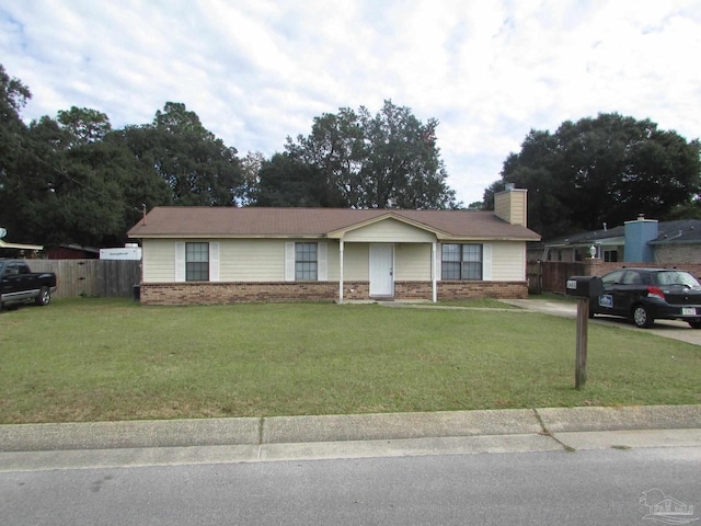 6486 Bellview Pines Ln, Pensacola, FL 32526 - ranch-style home featuring brick siding, a front lawn, fence, and a chimney