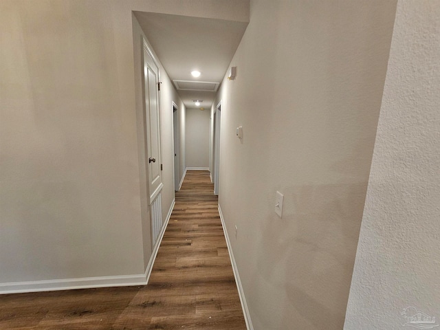 hall with dark hardwood / wood-style flooring