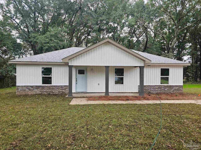 view of front of home with a front lawn and a porch