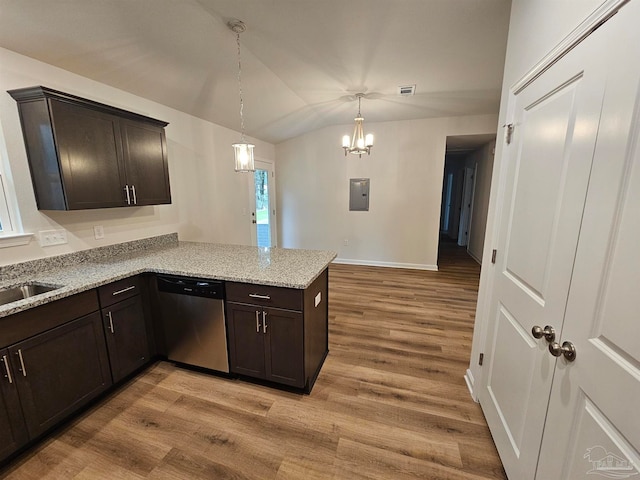 kitchen featuring stainless steel dishwasher, lofted ceiling, light wood-type flooring, and kitchen peninsula