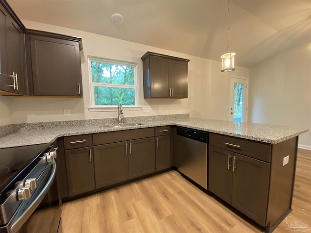 kitchen featuring kitchen peninsula, appliances with stainless steel finishes, sink, and light hardwood / wood-style flooring