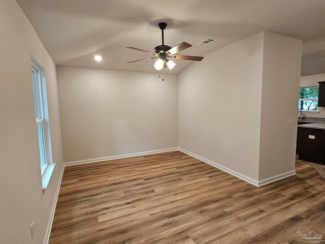 empty room with hardwood / wood-style flooring and ceiling fan