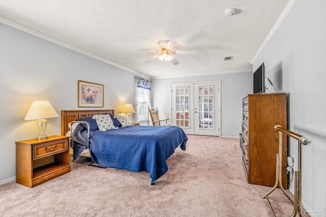 carpeted bedroom featuring access to outside, french doors, ceiling fan, ornamental molding, and a textured ceiling