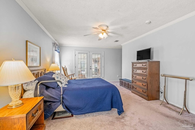 carpeted bedroom featuring ceiling fan, crown molding, a textured ceiling, and french doors