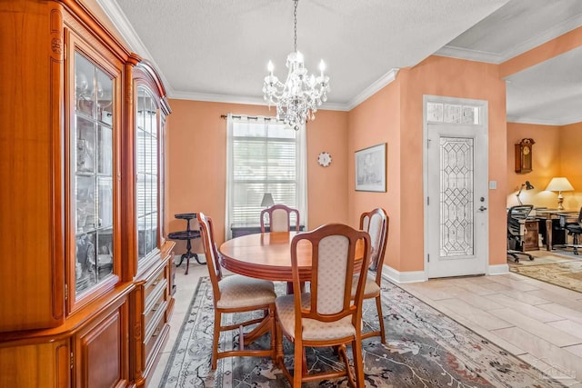 dining space with a textured ceiling, a notable chandelier, and ornamental molding