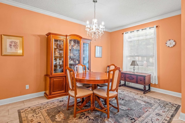 dining room featuring a textured ceiling, crown molding, a notable chandelier, and light tile patterned flooring