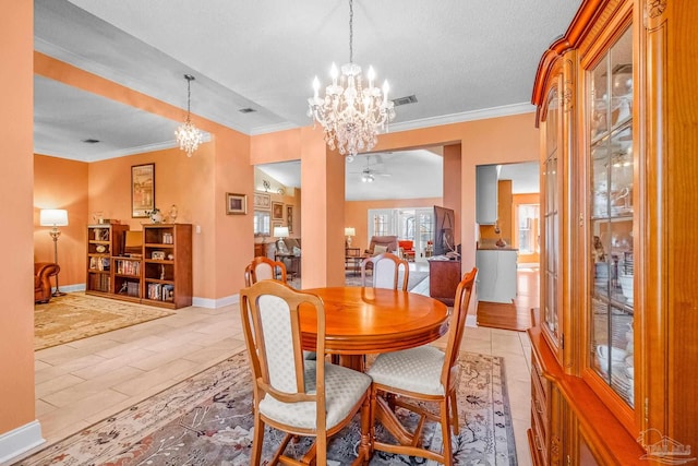 dining room featuring ceiling fan with notable chandelier, a textured ceiling, and ornamental molding