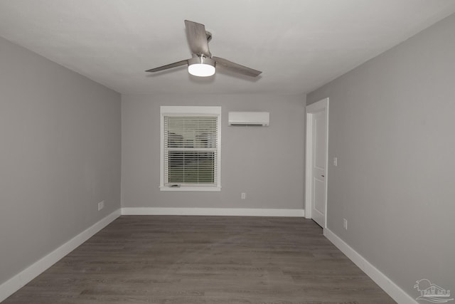 empty room featuring ceiling fan, dark hardwood / wood-style floors, and an AC wall unit