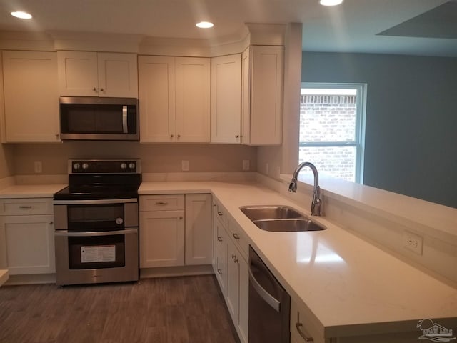 kitchen featuring stainless steel appliances and white cabinets