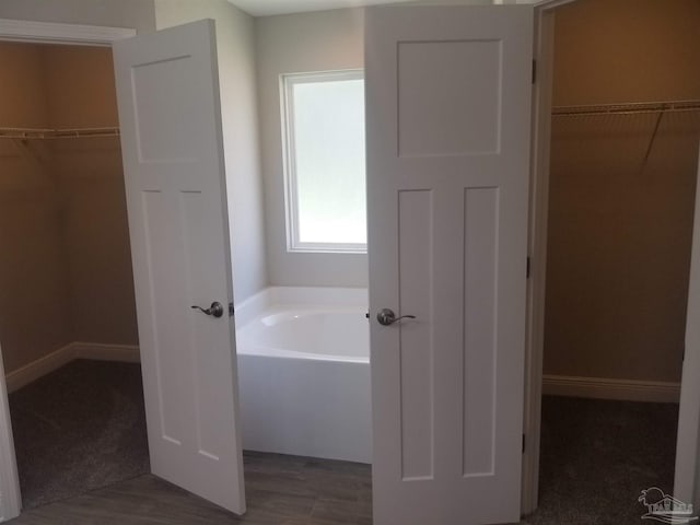 bathroom with a washtub