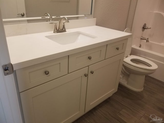 full bathroom featuring shower / bathtub combination, wood-type flooring, vanity, and toilet