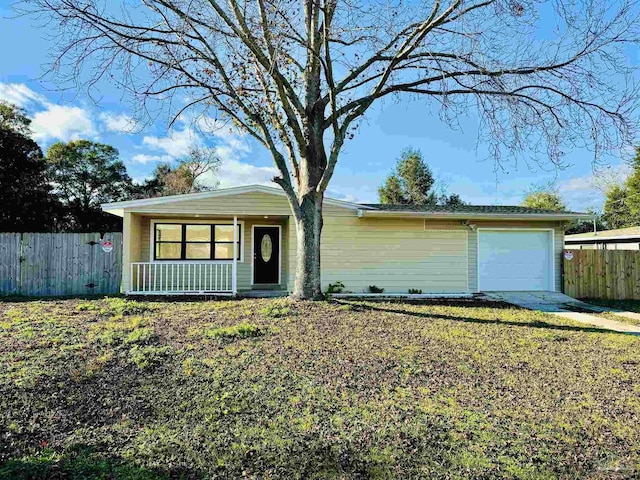 single story home featuring a porch and a garage