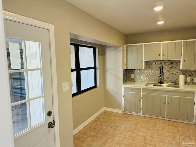 kitchen with backsplash and sink