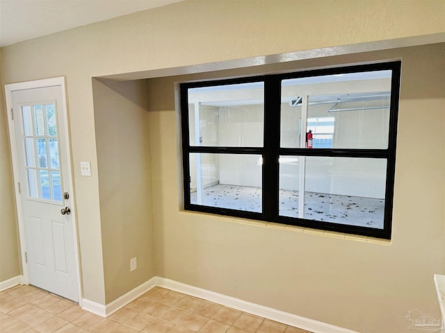 tiled entryway featuring a wealth of natural light