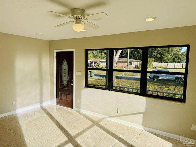 entryway with ceiling fan and light tile patterned floors