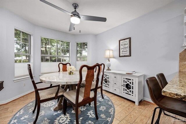 dining area featuring light hardwood / wood-style floors and ceiling fan