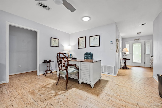 office area with ceiling fan and light hardwood / wood-style flooring