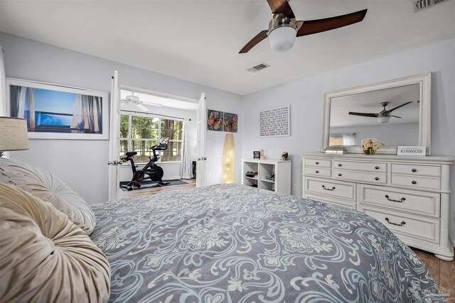 bedroom with hardwood / wood-style floors and ceiling fan