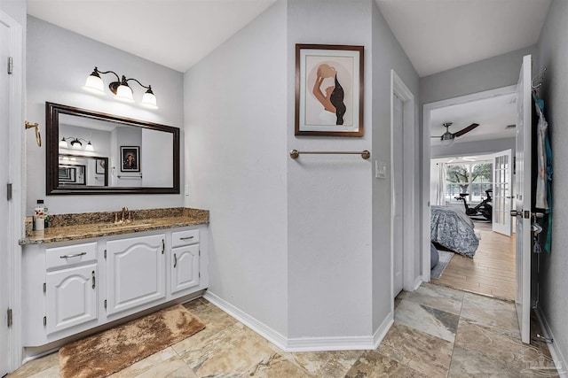 bathroom with vanity, hardwood / wood-style floors, and ceiling fan