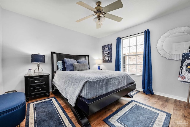 bedroom featuring ceiling fan and dark hardwood / wood-style floors