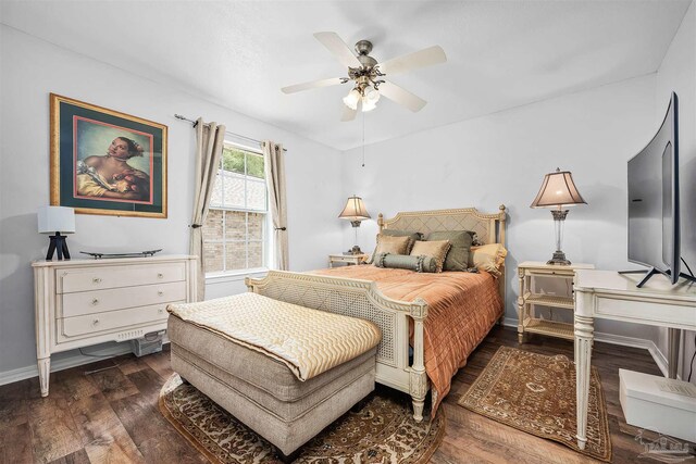 bedroom featuring dark wood-type flooring and ceiling fan