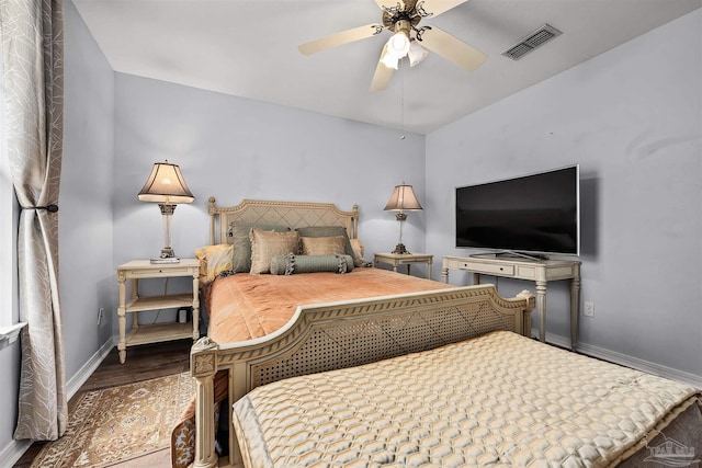 bedroom with wood-type flooring and ceiling fan