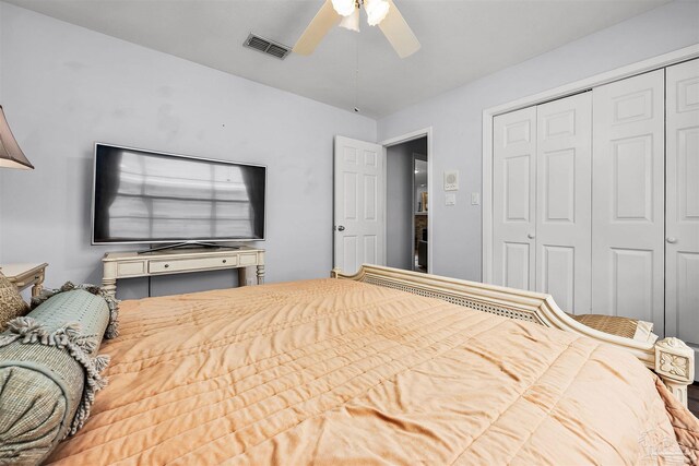 bedroom featuring ceiling fan and a closet