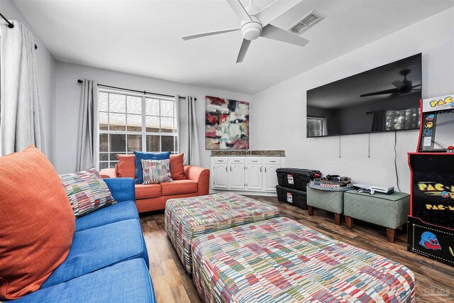 bedroom with hardwood / wood-style floors and ceiling fan