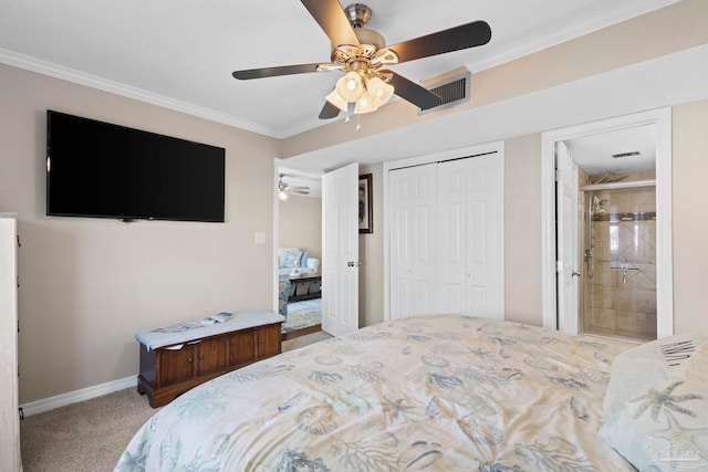 carpeted bedroom featuring connected bathroom, crown molding, a closet, and ceiling fan