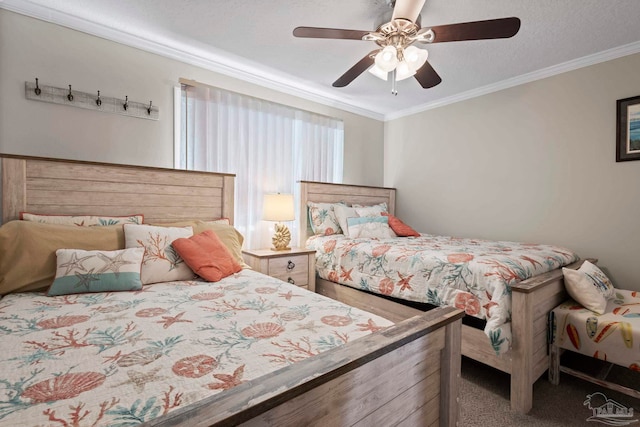 carpeted bedroom featuring ceiling fan, ornamental molding, and a textured ceiling