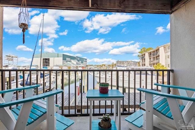 balcony featuring a water view