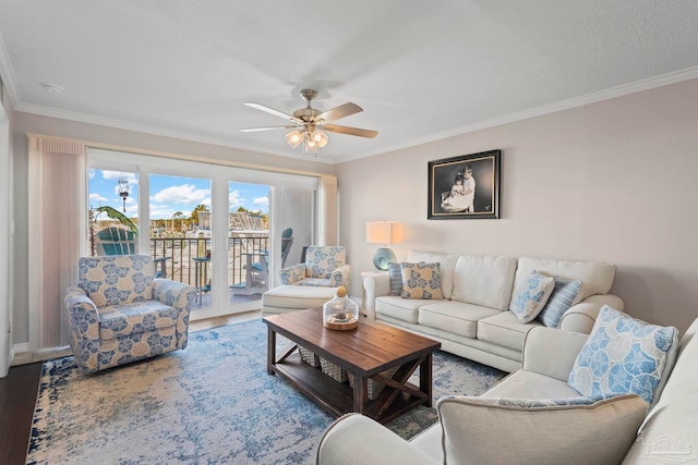 living room with crown molding, hardwood / wood-style floors, and ceiling fan