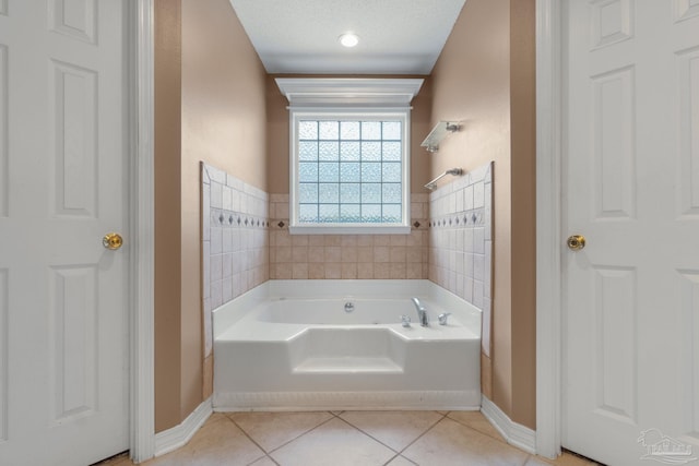 2215 Seascale Ct, Navarre, FL 32566 - bathroom with tile patterned flooring, a garden tub, and baseboards