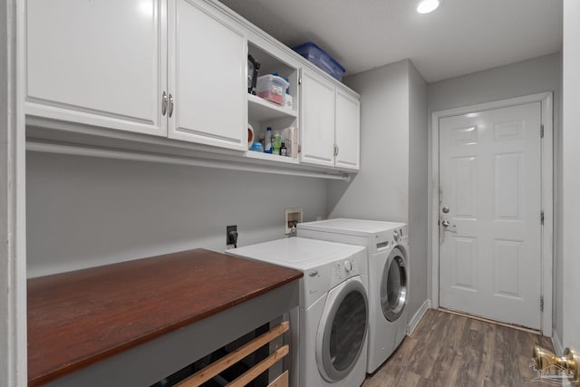 2215 Seascale Ct, Navarre, FL 32566 - clothes washing area with cabinet space, independent washer and dryer, dark wood-style floors, and recessed lighting