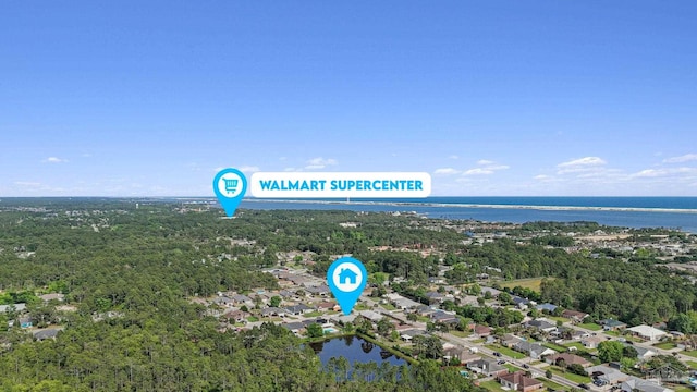 2215 Seascale Ct, Navarre, FL 32566 - aerial overview of property's location featuring a large body of water, nearby suburban area, and a forest