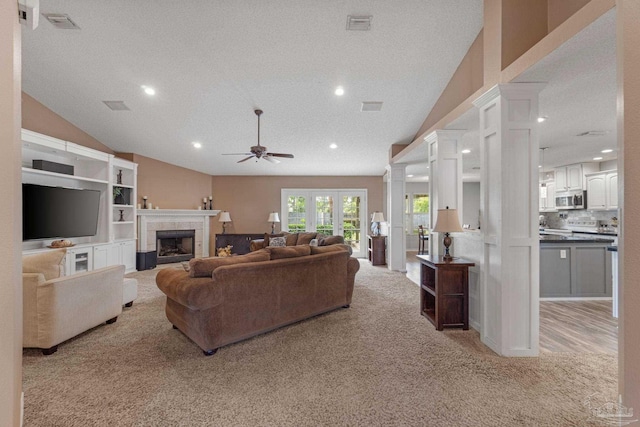 2215 Seascale Ct, Navarre, FL 32566 - living area featuring light colored carpet, a ceiling fan, lofted ceiling, recessed lighting, and ornate columns