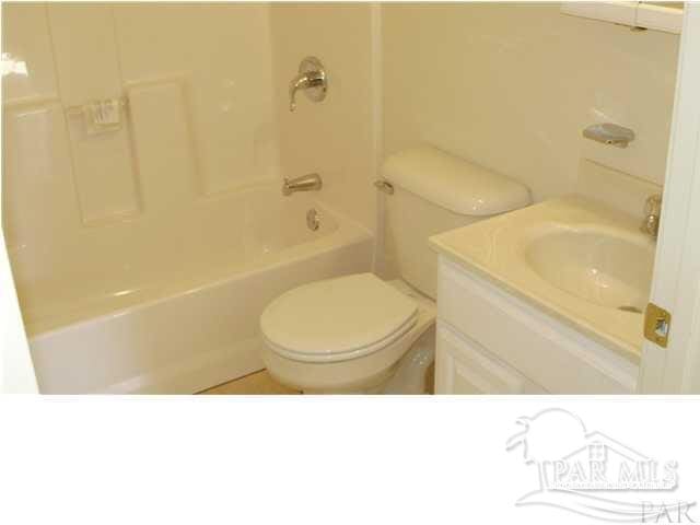 full bathroom featuring toilet, shower / bathtub combination, and vanity