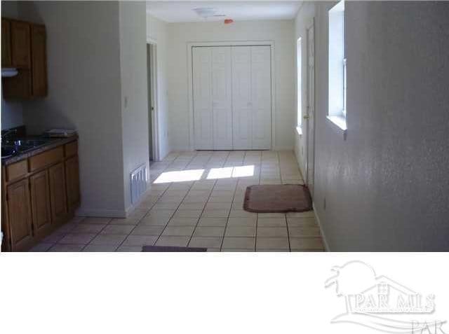 kitchen with light tile patterned floors