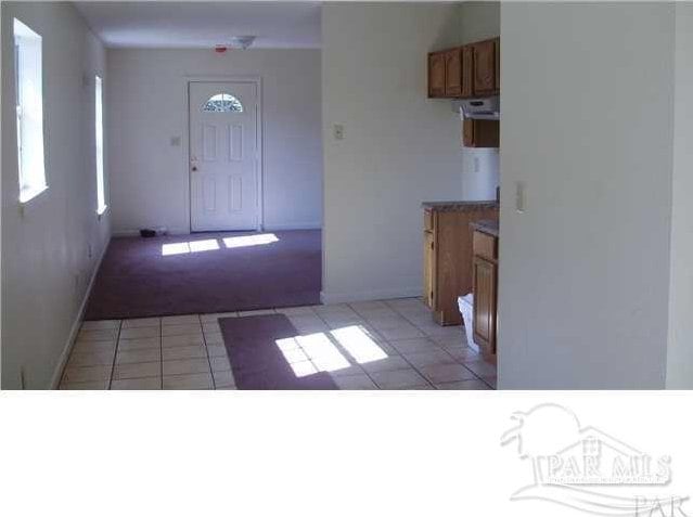 foyer with light carpet