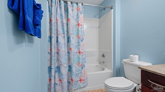 full bathroom featuring shower / tub combo, tile patterned flooring, vanity, and toilet