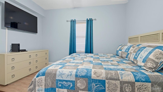 bedroom featuring hardwood / wood-style flooring