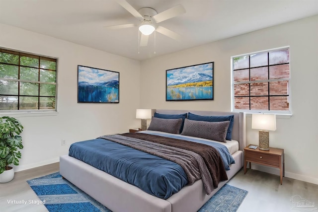 bedroom featuring wood-type flooring and ceiling fan