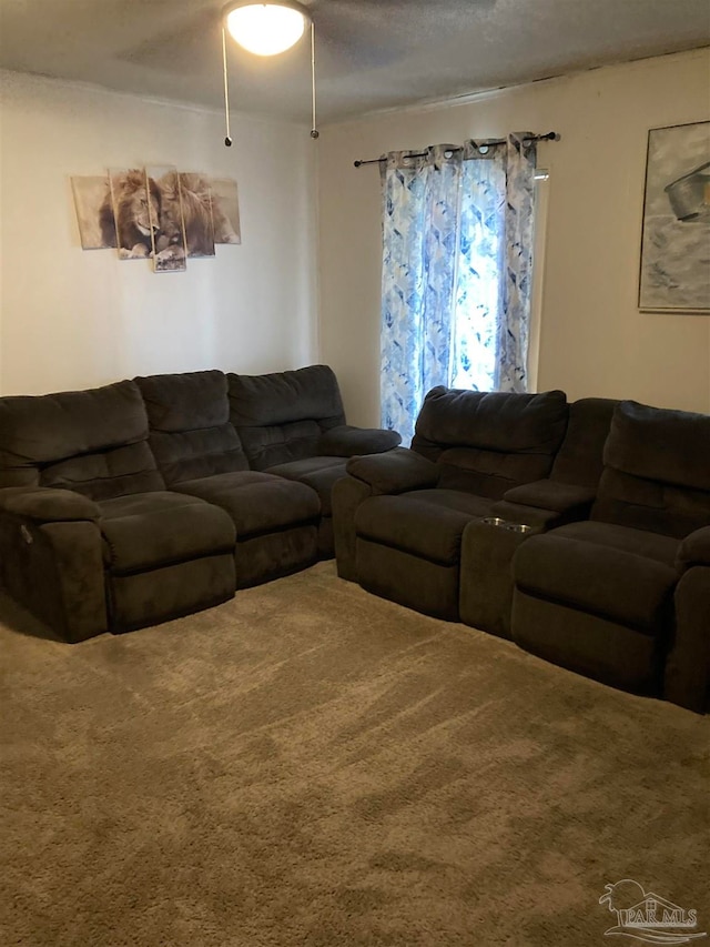 carpeted living room featuring ceiling fan