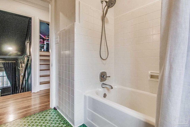 bathroom with tile patterned flooring and shower / bathtub combination with curtain