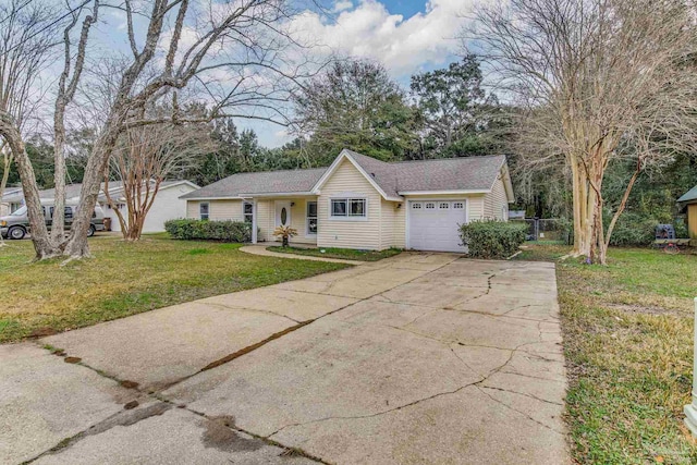 ranch-style house with a garage and a front lawn