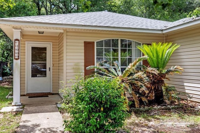 1009 Simpson St, Pensacola, FL 32526 - view of exterior entry with a shingled roof